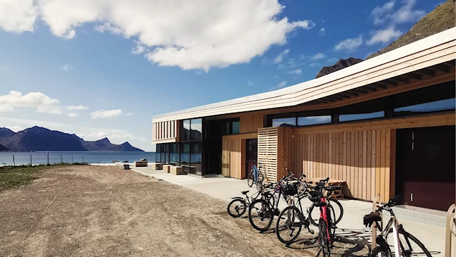 Several bicycles are parked outside the visitor center.