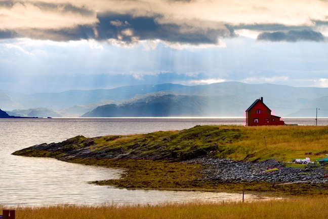 The road out to Havøysund is fascinatingly varied. Parts of the road traverse a barren rocky landscape with the Arctic Ocean on one side and rugged outcrops on the other. 