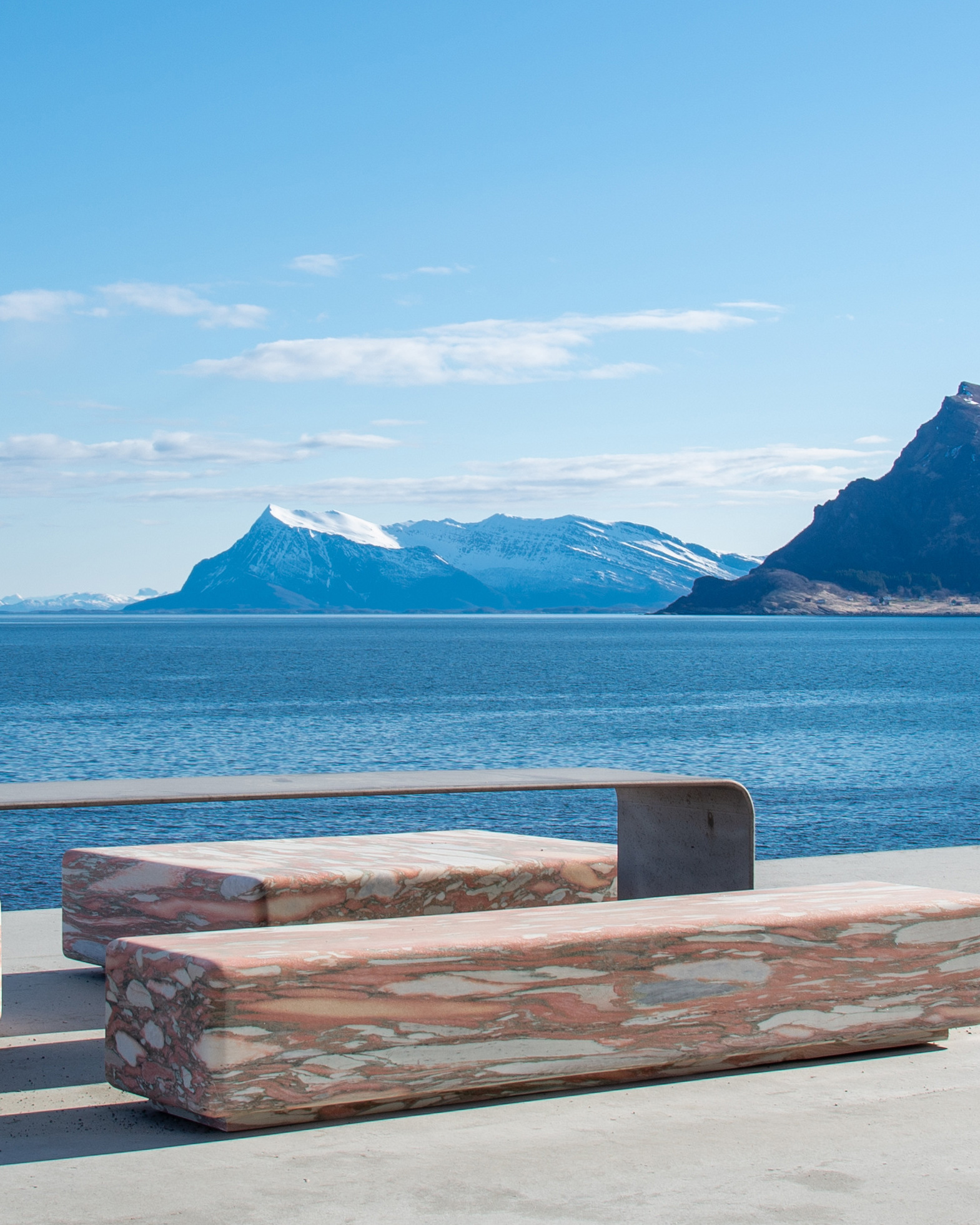 The Ureddplassen rest area with sea view, benches made of polished limestone marble.