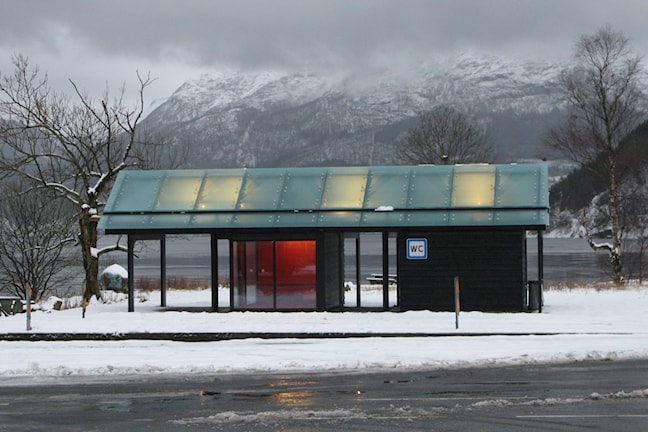 The toilet building in winter landscape.